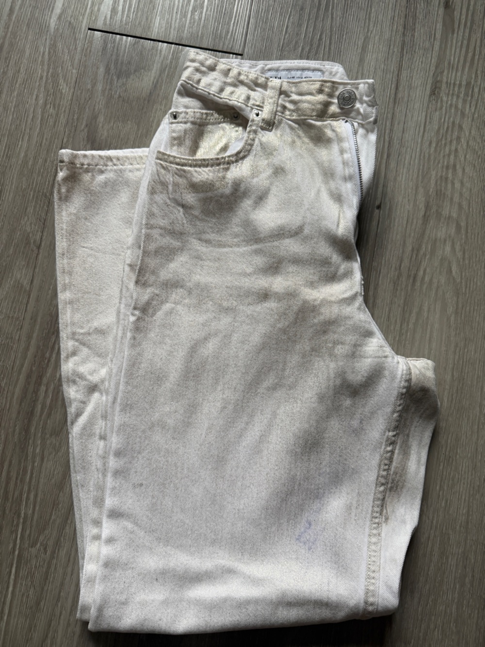 White jeans with gold overlay